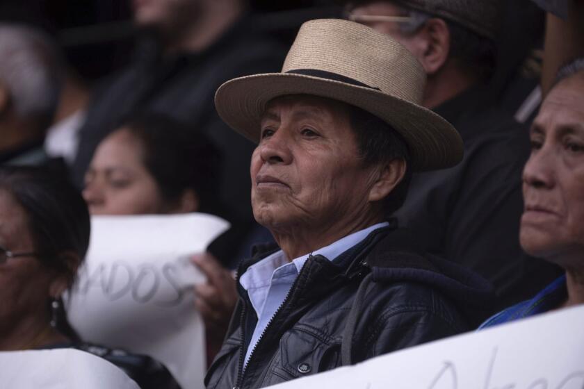 People gather to show support for the Constitutional Court which blocked President Jimmy Morales' decision to end the United Nations International Commission Against Impunity, in Guatemala City, Wednesday, Jan. 9, 2019. The commission, known by its Spanish initials as CICIG, has angered Morales by investigating him, his sons and his brother on accusations of corruption, which they deny. (AP Photo/Santiago Billy)