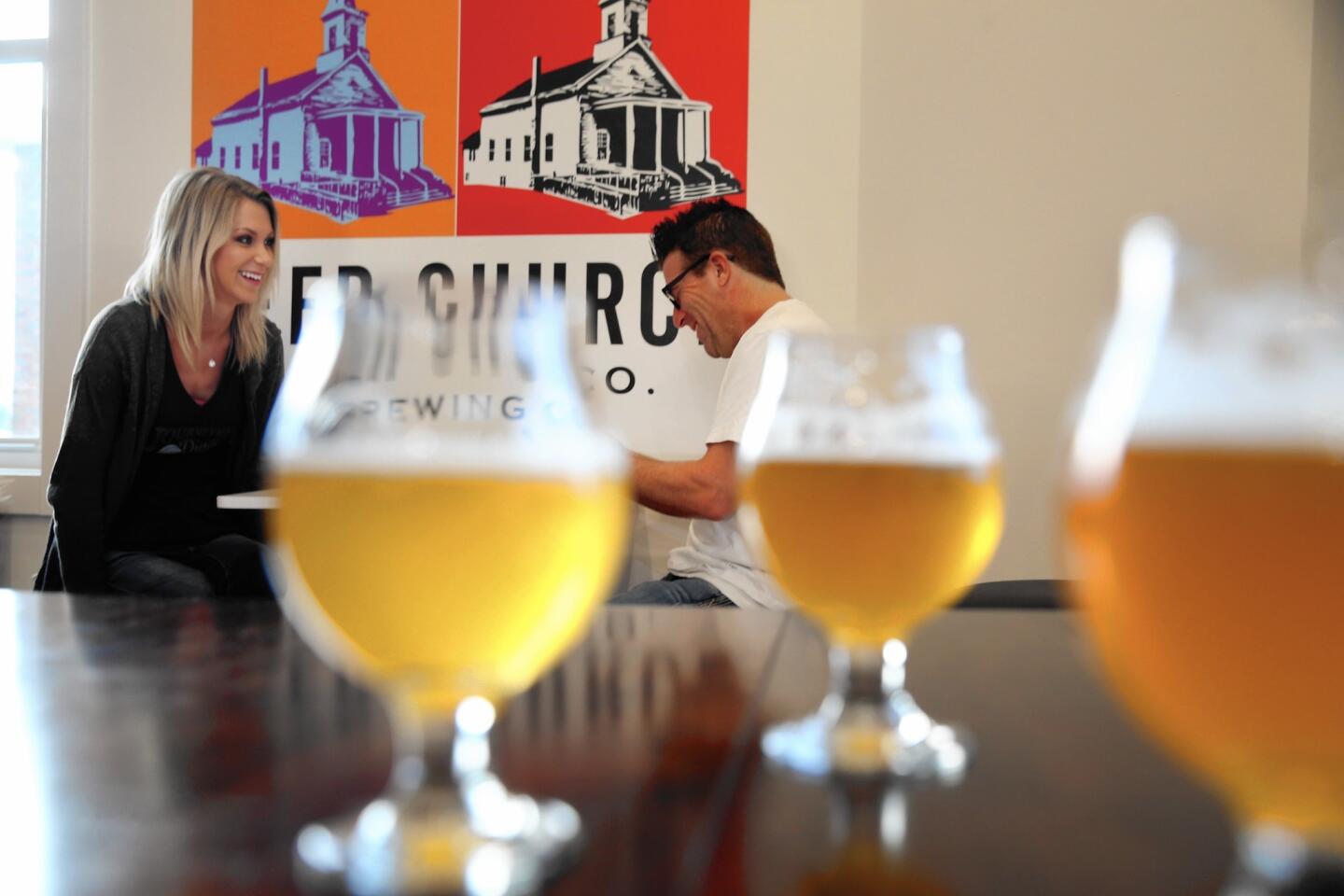 Customers Emily Delinski and David Szuch of South Bend, Ind., at Beer Church in New Buffalo, Mich.