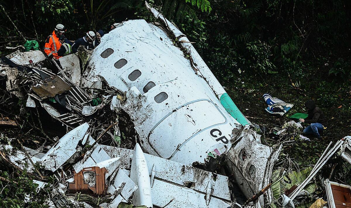 Teams work to recover the bodies of victims of the Nov. 29 plane crash that killed many members of the Brazilian football team Chapecoense Real.
