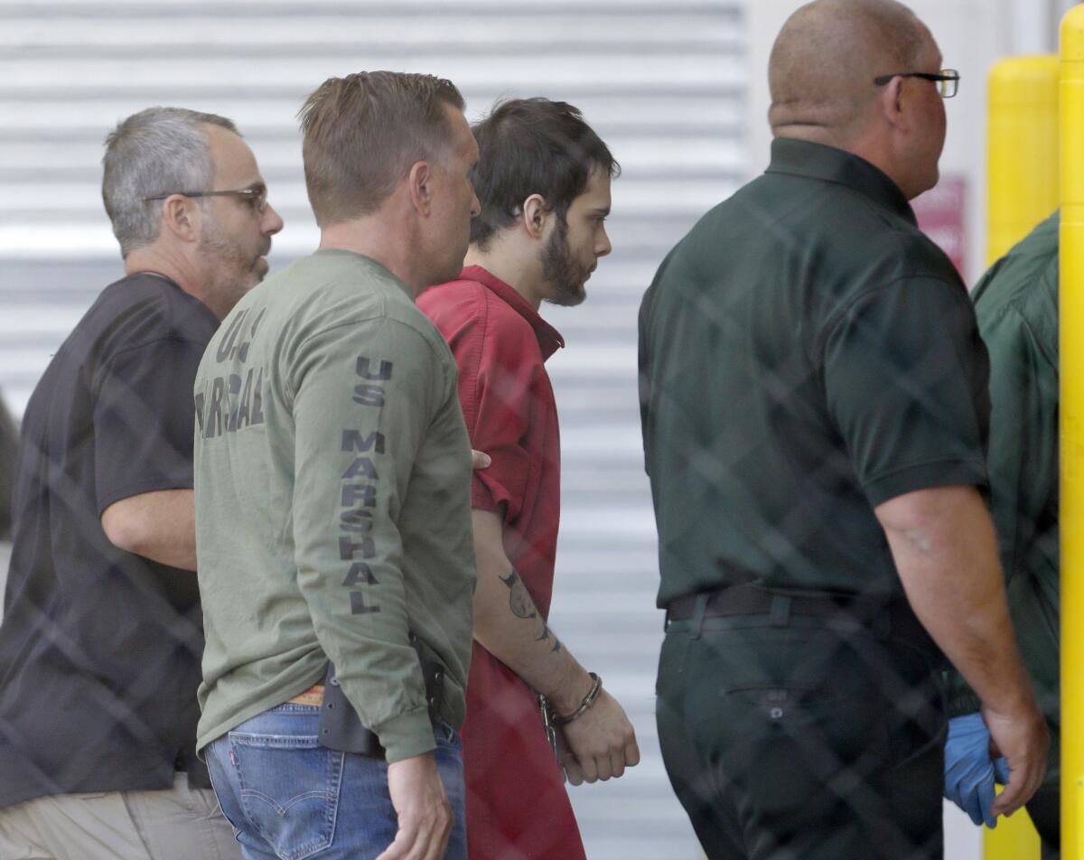 Esteban Santiago, third from left, returns to Broward County's main jail after his first court appearance on Jan 9.