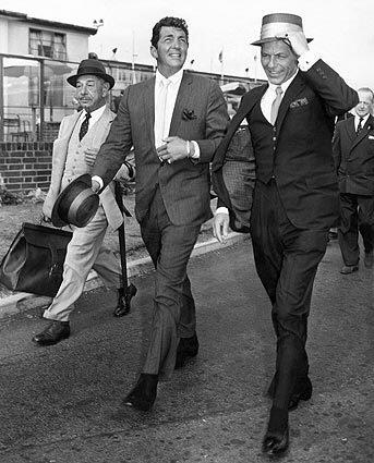 "Marching through Heathrow Airport, 1961." Photo from the book "The Rat Pack" by Reel Art Press. Dean Martin and Frank Sinatra with Beverly Hills restauranteur Mike Romanoff (left). Photo by J Wilds/Getty Images.