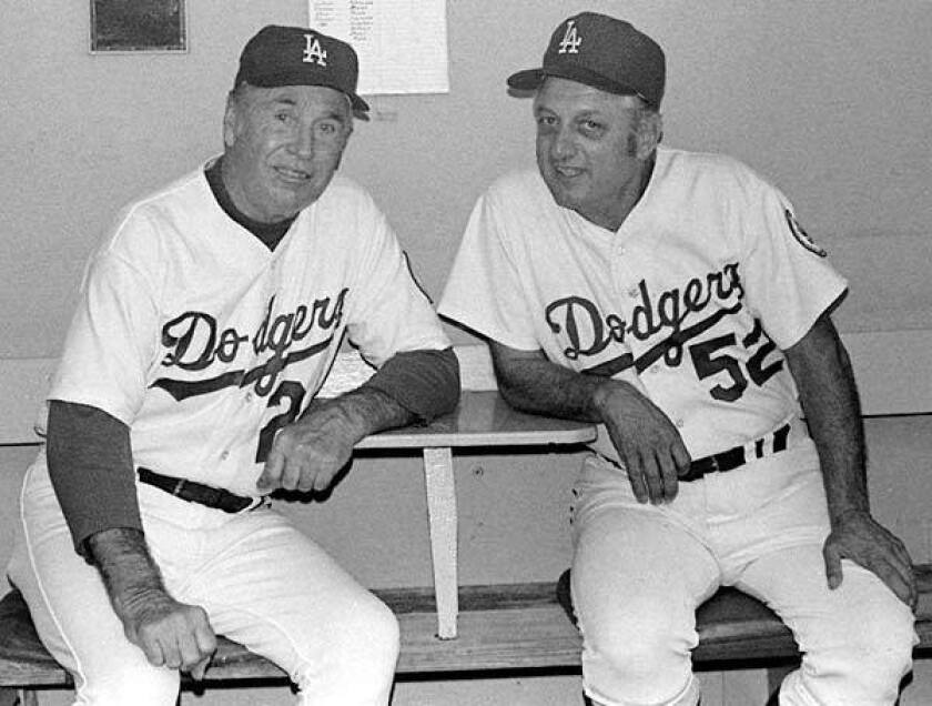 Walt Alston, left, with then third-base coach Tommy Lasorda in 1975.