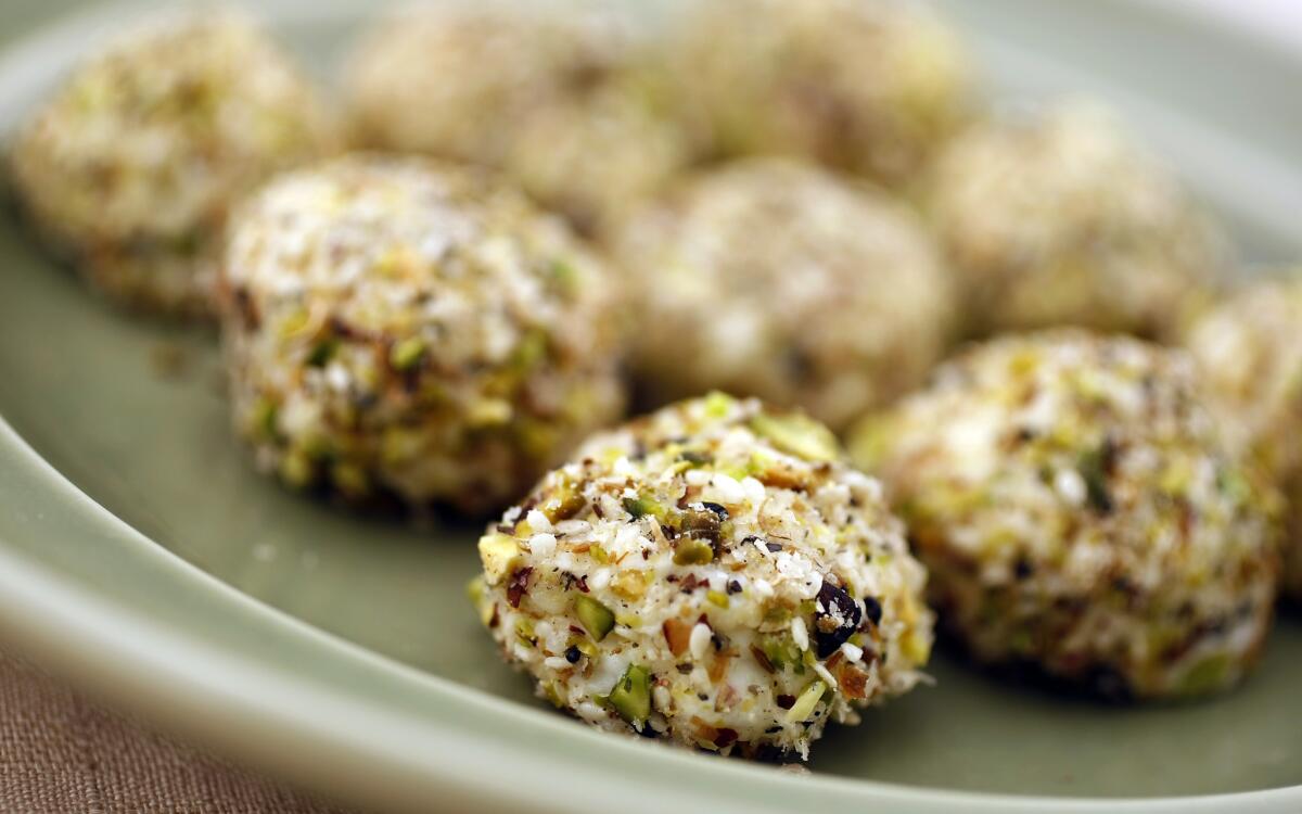 Cream cheese balls with sesame and pistachios