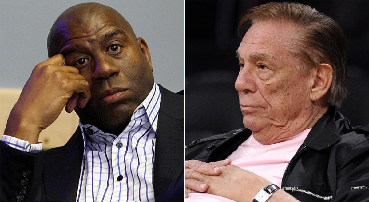 Former Lakers great Magic Johnson, left, said he will never attend a Clippers game at Staples Center again after owner Donald Sterling allegedly made racist comments that involved Johnson.