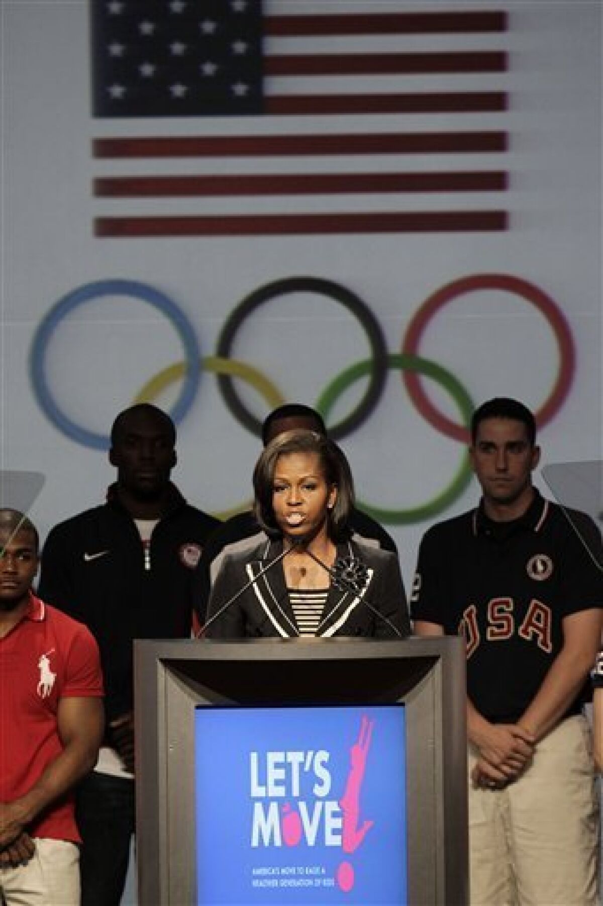 First lady Michelle Obama speaks during a news conference in Dallas, Monday, May 14, 2012, with athletes at the 2012 Team USA Media Summit. The first lady announced a new Let's Move initiative to combat childhood obesity. (AP Photo/LM Otero)