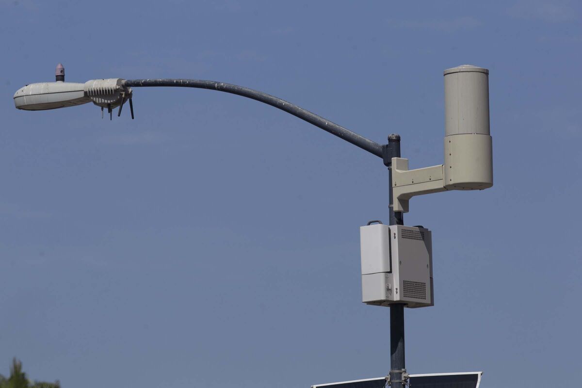 A light pole with attached sensors that make it a smart streetlight