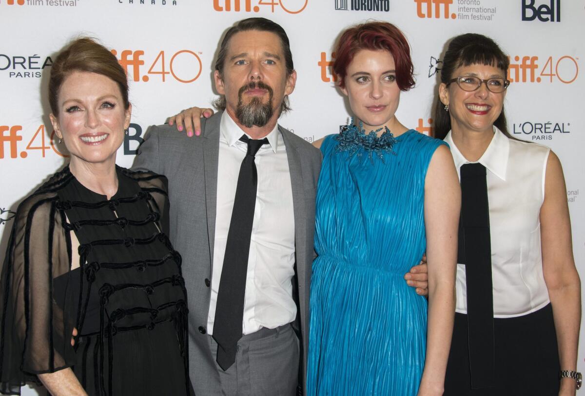 Julianne Moore, from left, Ethan Hawke, Greta Gerwig and director Rebecca Miller arrive for the screening of "Maggie's Plan" on Saturday during the Toronto International Film Festival.