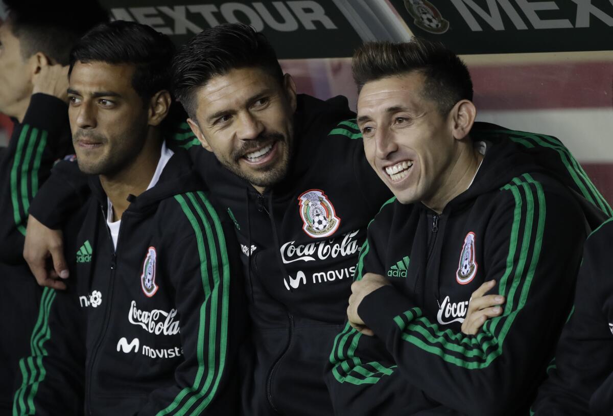 Mexico's Carlos Vela, left, Oribe Peralta, middle, 