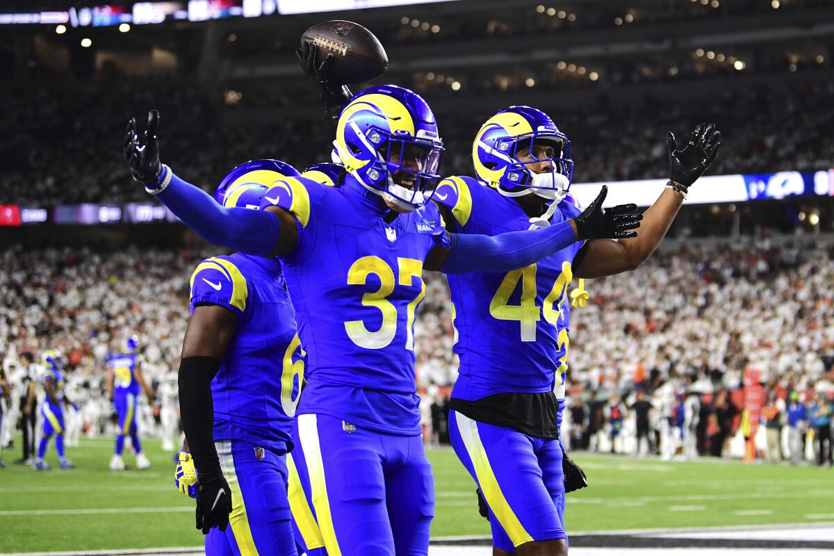 Rams cornerback Ahkello Witherspoon and safety Quentin Lake celebrate an interception.