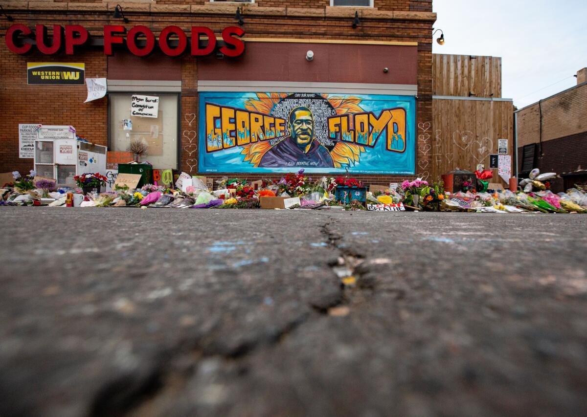 The mural and makeshift memorial outside Cup Foods, where George Floyd was murdered.