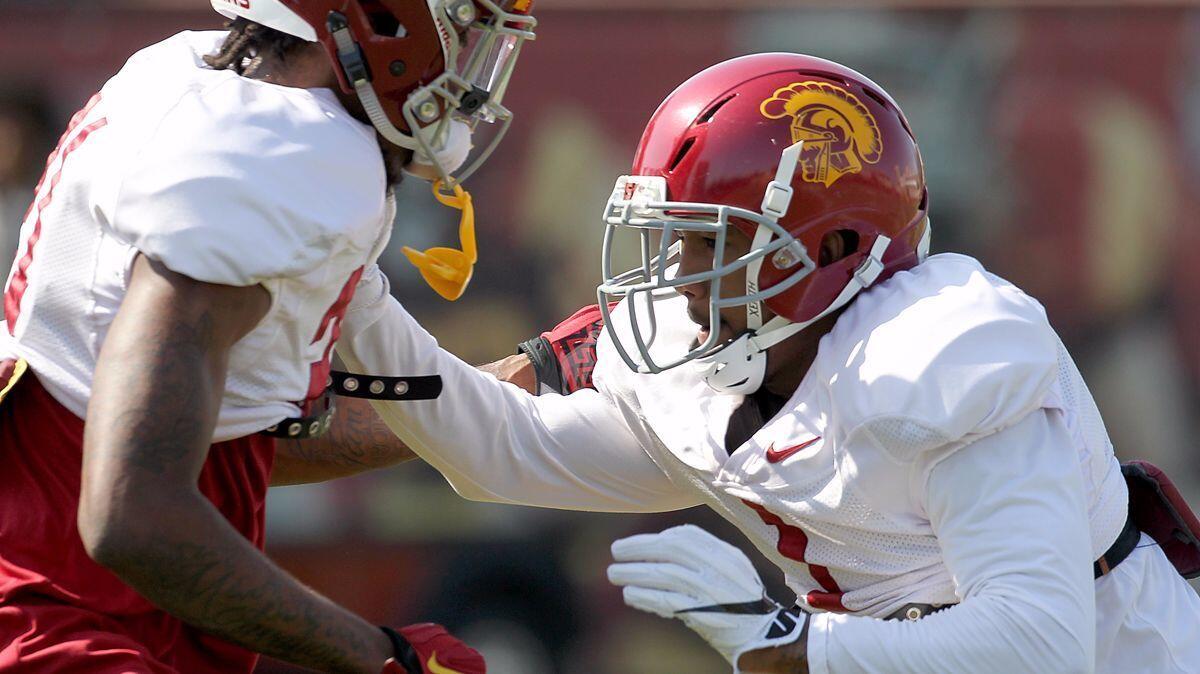 USC cornerback Jack Jone, right, participates in spring practice at USC on Tuesday.