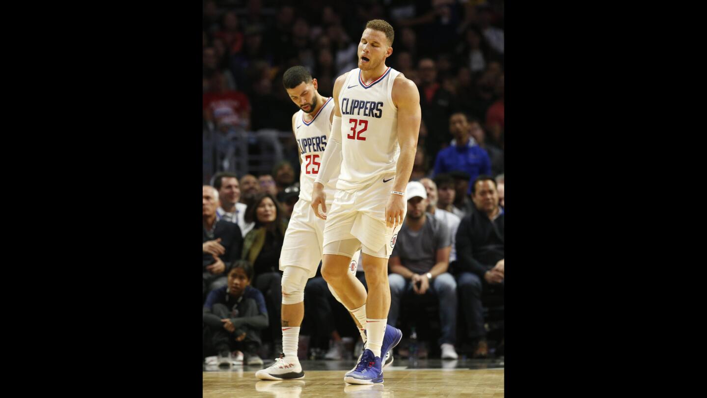 Clippers forward Blake Griffin limps to the bench after being injured late in the fourth quarter against the Lakers.