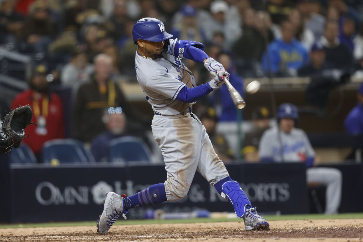 Los Angeles Dodgers' Mookie Betts hits a home run against the San Diego Padres.