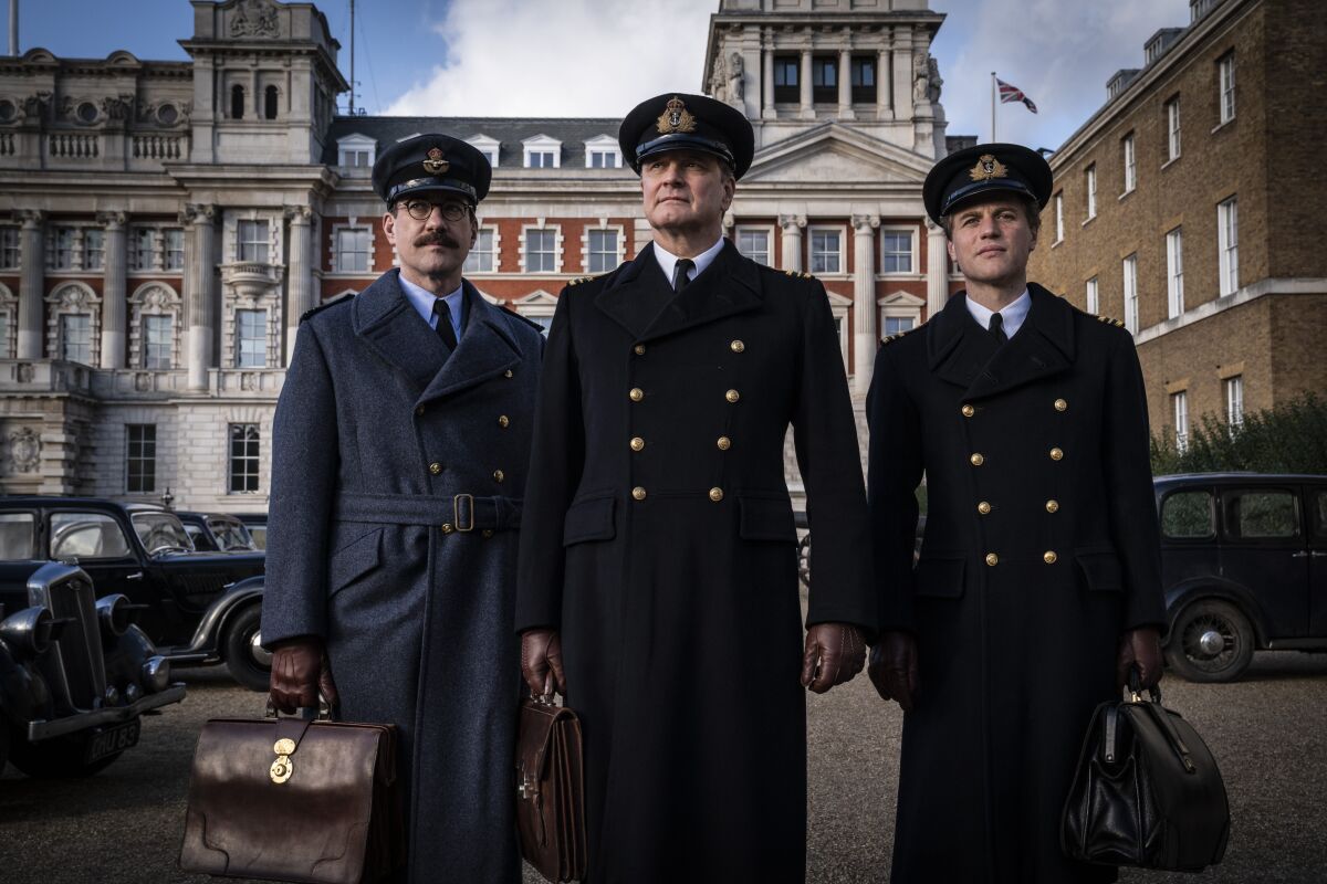 Three British officers carrying attache cases in the movie "Operation Mincemeat."