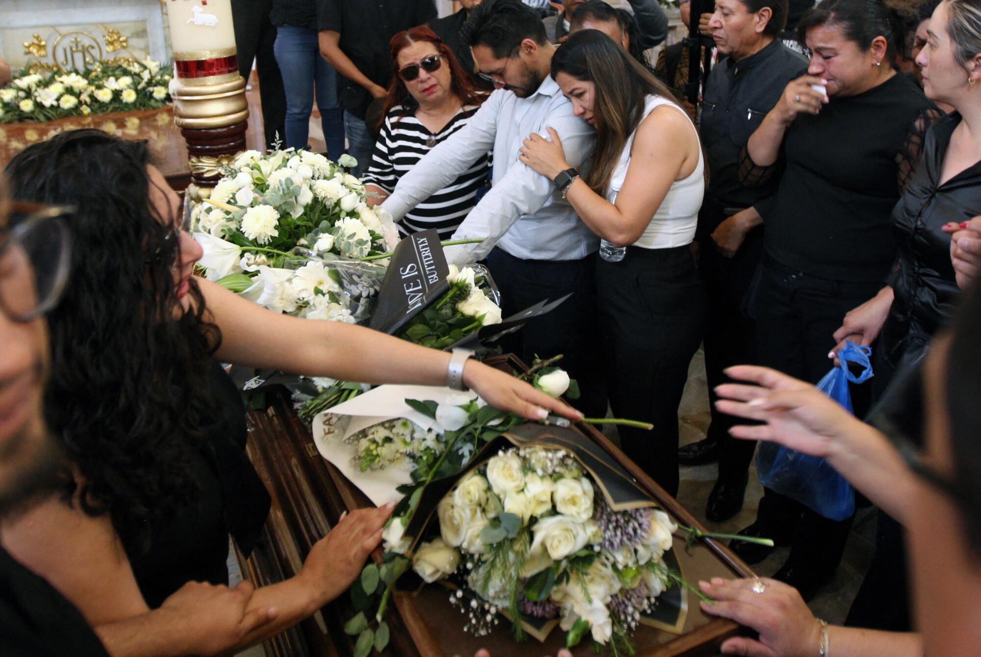 Relatives of Gisela Gaytán mourn during her funeral in Celaya, Guanajuato State, Mexico, 