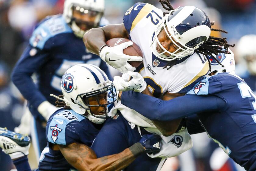 Rams Sammy Watkins carries the ball against the Titans.