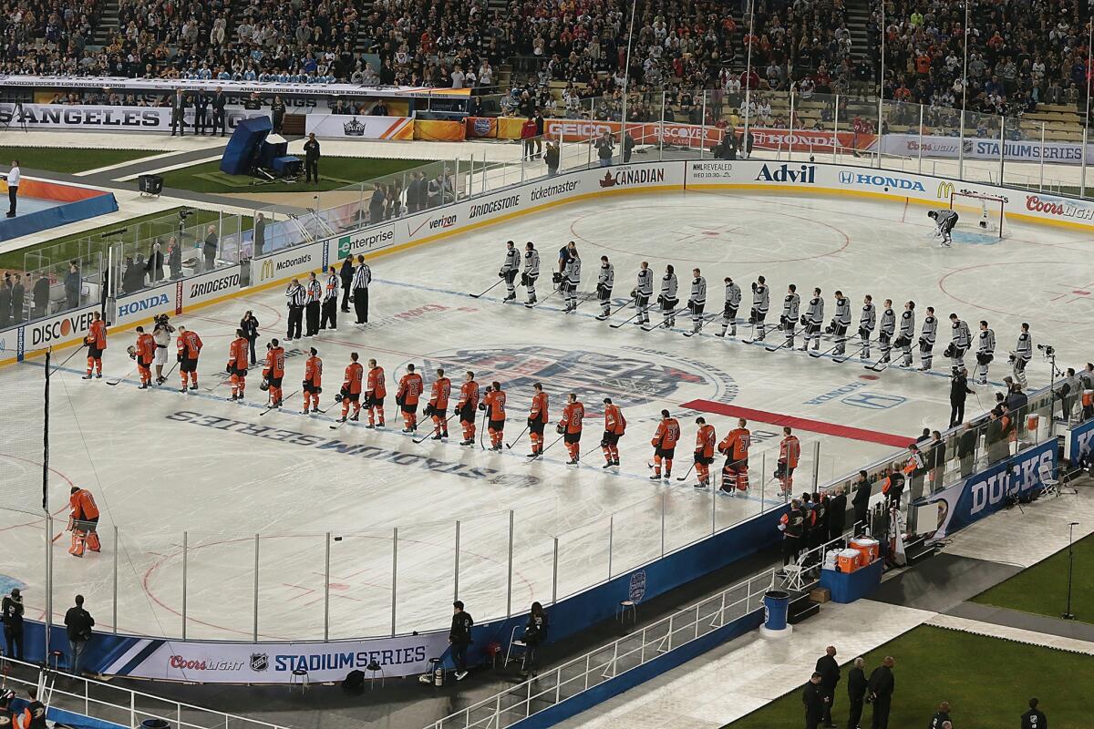 The Kings and Ducks line up Jan. 25 for pregame ceremonies on the infield of Dodger Stadium as part of the NHL's Stadium Series.