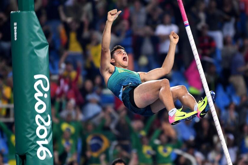 Brazil's Thiago Braz da Silva reacts after clinching the gold medal in pole vault with an Olympic-record 19-7 1/4.