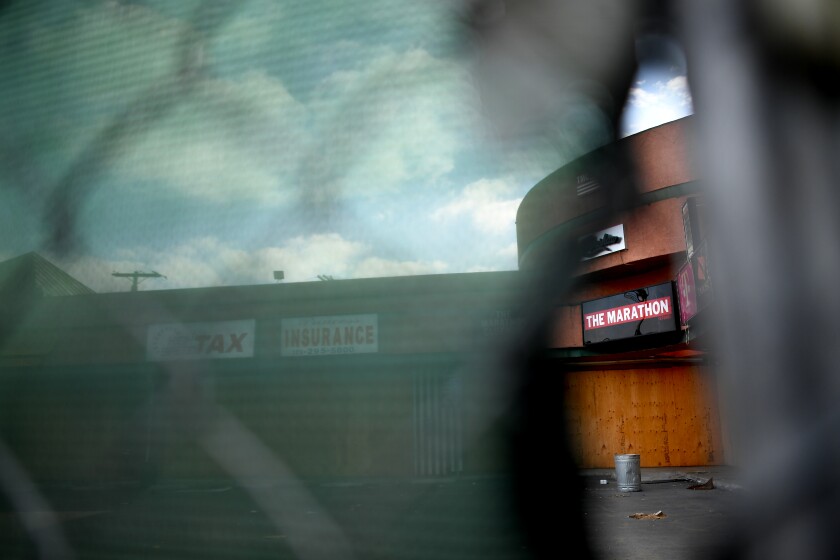 The Marathon Clothing store, viewed through a fence surrounding the property