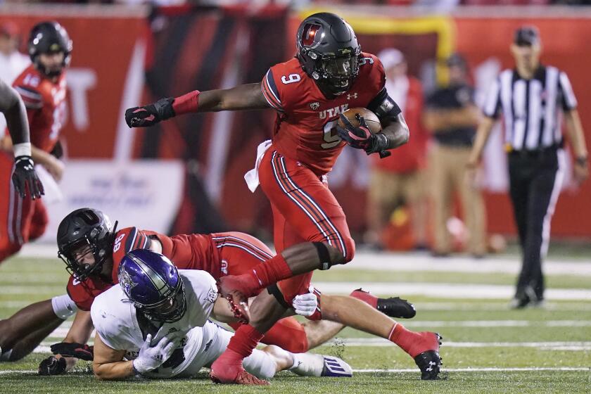 Utah running back Tavion Thomas (9) carries the ball during the second half of the team's NCAA college football game against Weber State on Thursday, Sept. 2, 2021, in Salt Lake City. (AP Photo/Rick Bowmer)