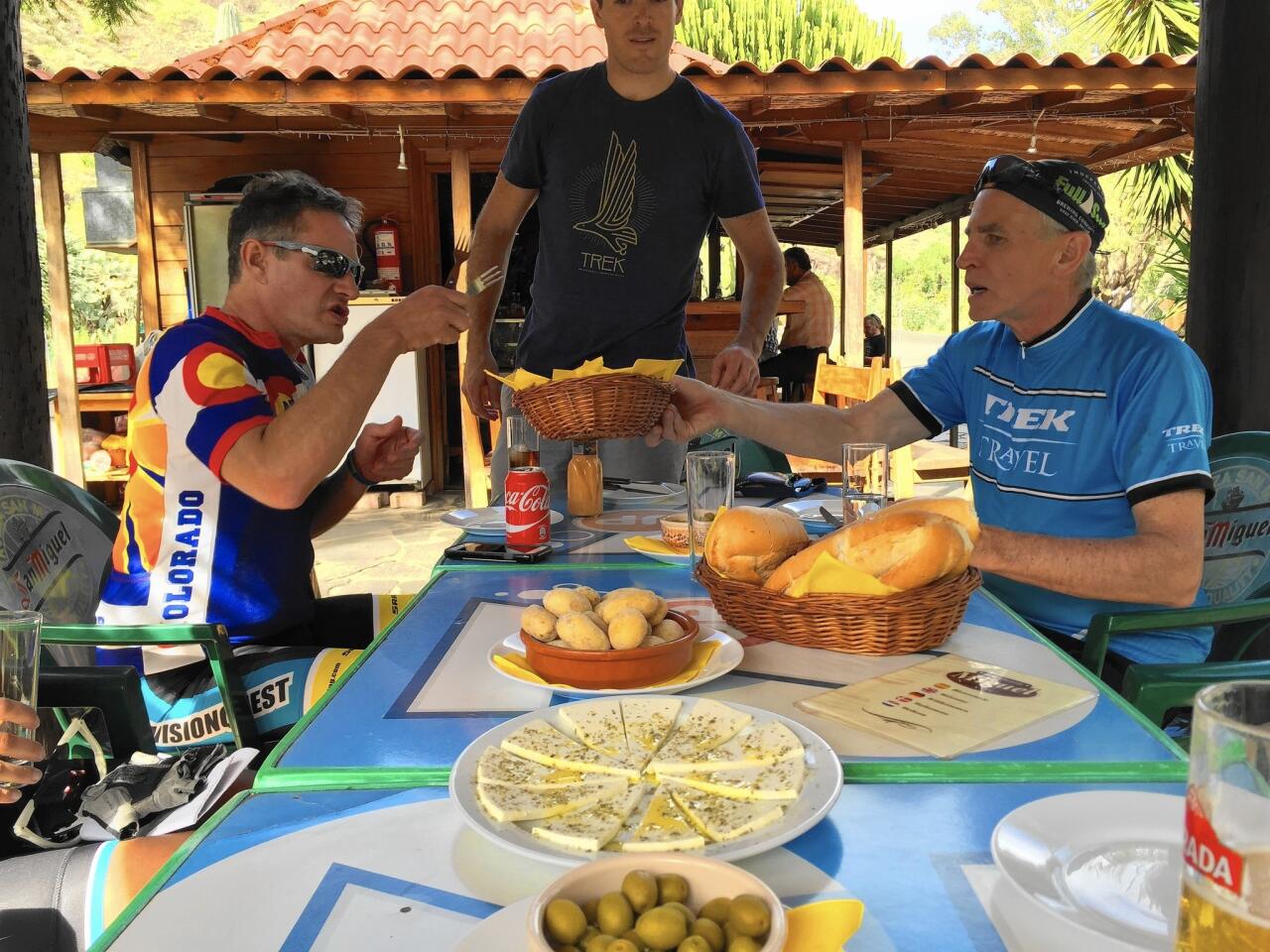 Cyclists refuel with cheese, bread and the island's papas arrugadas, a typical potato dish served with red or green "mojo" sauce.