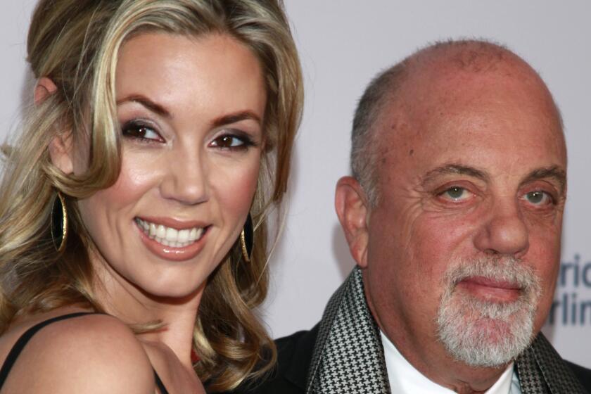 Alexis Roderick and Billy Joel, shown in 2013, got married in a surprise ceremony Saturday night during their annual July 4th party.