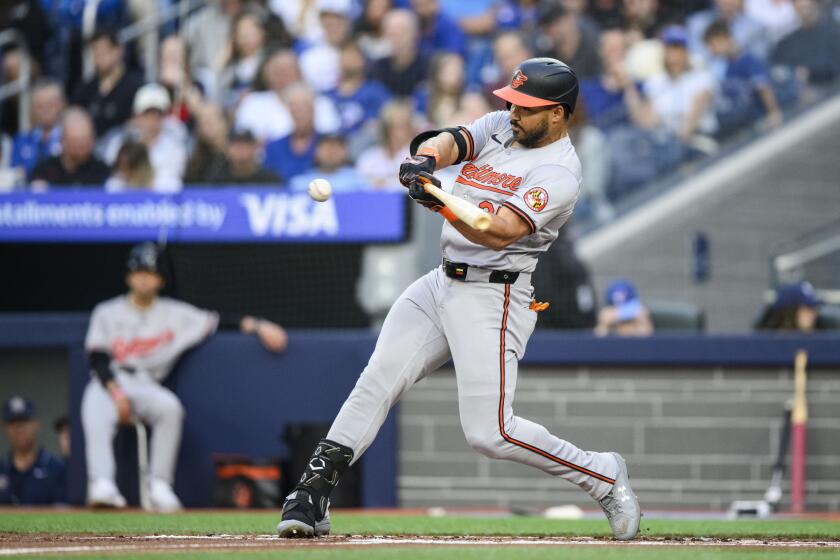 Baltimore Orioles' Anthony Santander hits a two-run home run during the second inning of a baseball game against the Toronto Blue Jays in Toronto, Monday, June 3, 2024. (Christopher Katsarov/The Canadian Press via AP)