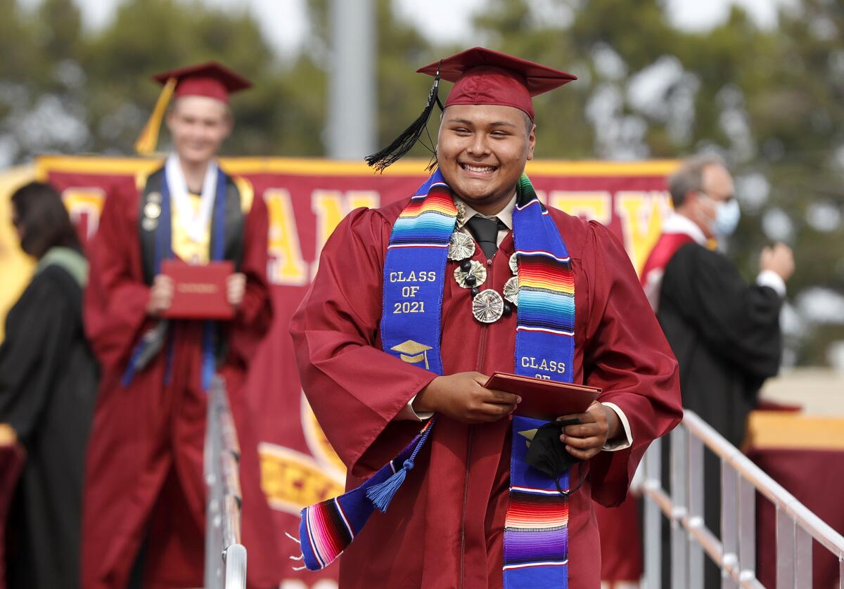 Joseph Espinoza wears a smile of pride after accepting his diploma during the Ocean View High graduation ceremony.