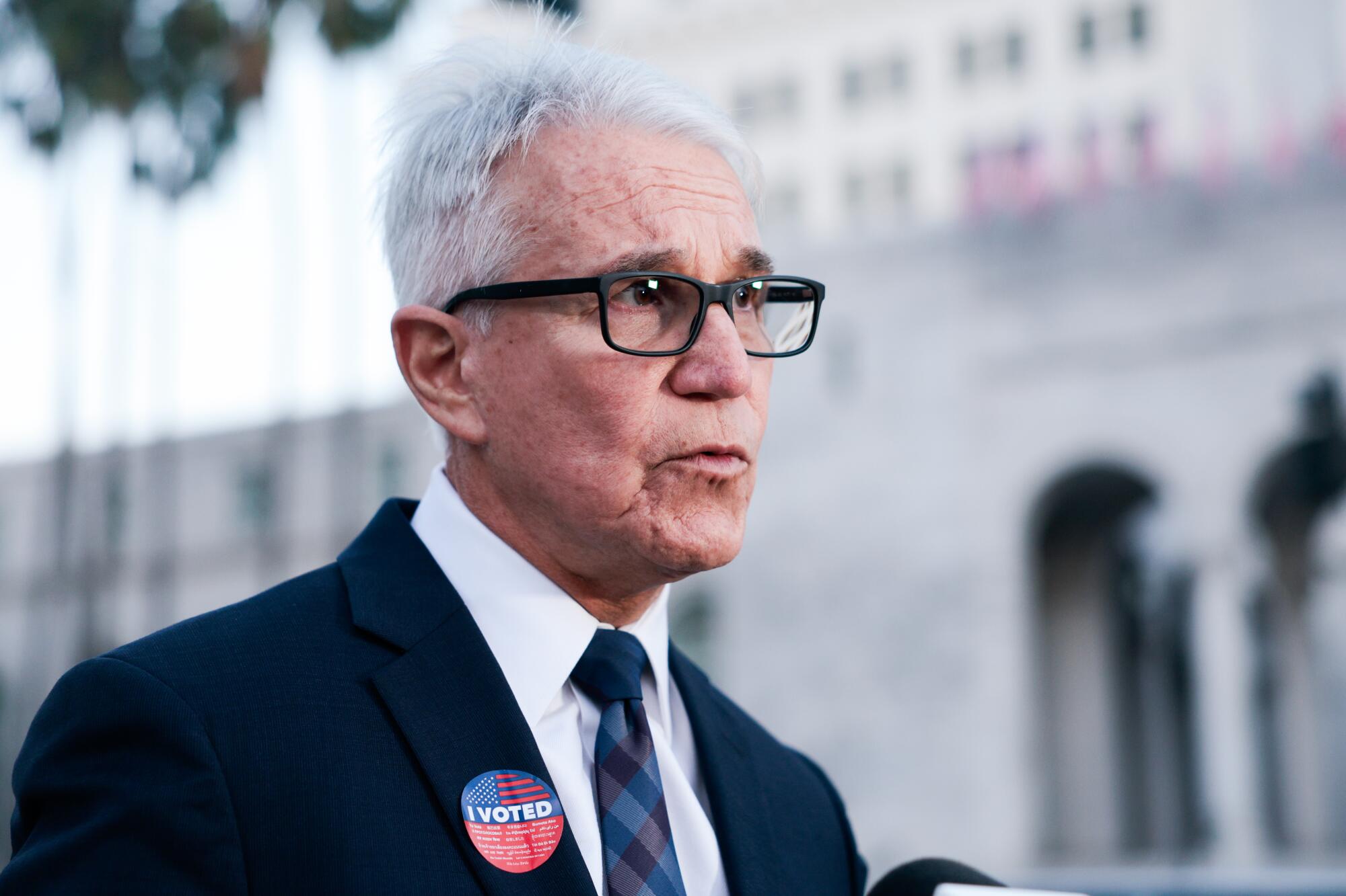  George Gascón wears an "I Voted" sticker.