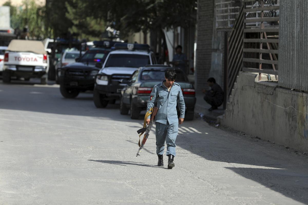 Afghan security personnel arrives at the area where the director of Afghanistan's Government Information Media Center Dawa Khan Menapal was shot dead in Kabul, Afghanistan, Friday, Aug. 6, 2021. The Taliban shot and killed the director of Afghanistan's Government Information Media Center on Friday, the latest killing of a government official and one that comes just days after an assassination attempt on the acting defense minister. (AP Photo/Rahmat Gul)