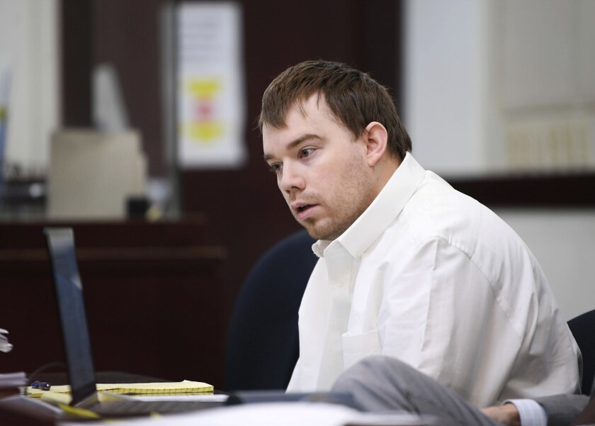 Travis Reinking sits in court while the jury wasn't present during the third day of his murder trial at the Justice A.A. Birch Building in Nashville, Tenn., Wednesday, Feb. 2, 2022. Reinking is charged with four counts of first degree murder, along with other attempted murder and weapons charges for a shooting in 2018 at a Nashville Waffle House. (Stephanie Amador/The Tennessean via AP, Pool)