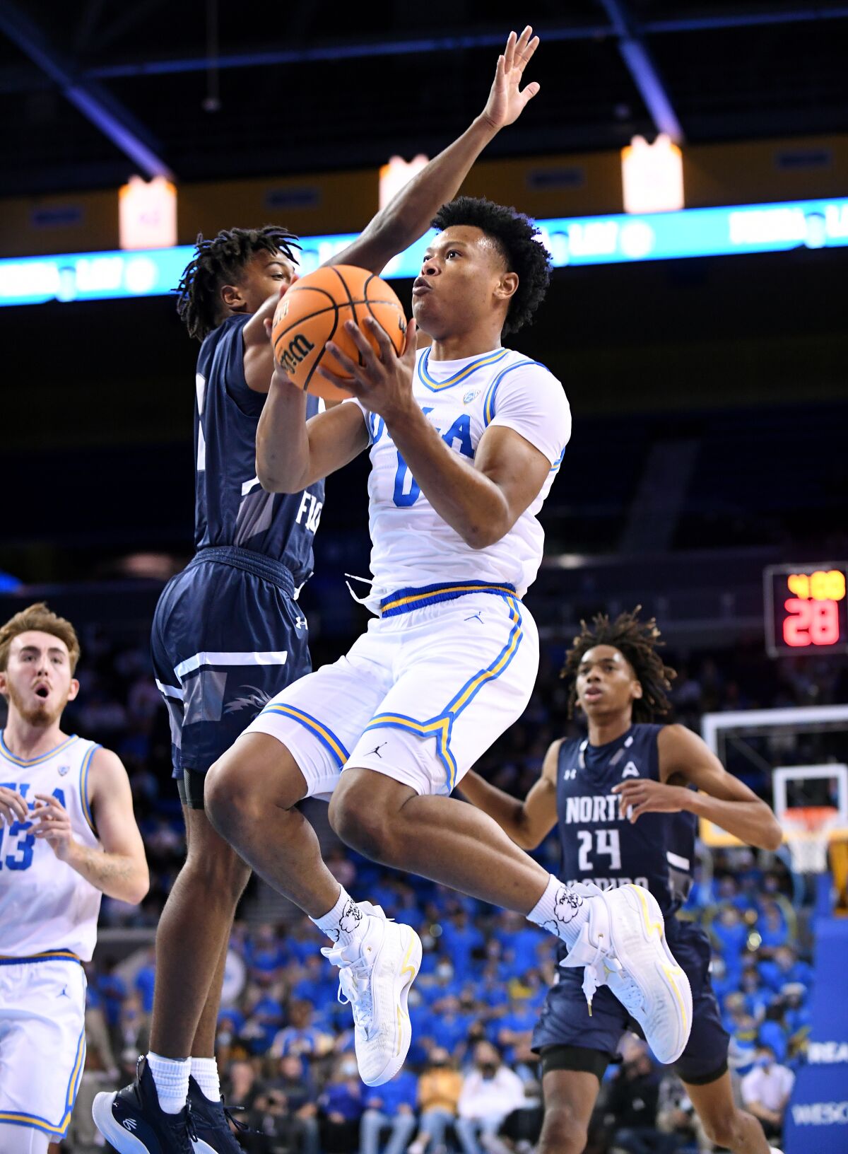 UCLA's Jaylen Clark drives past North Florida's Jadyn Parker in the second half at Pauley Pavilion Wednesday. 