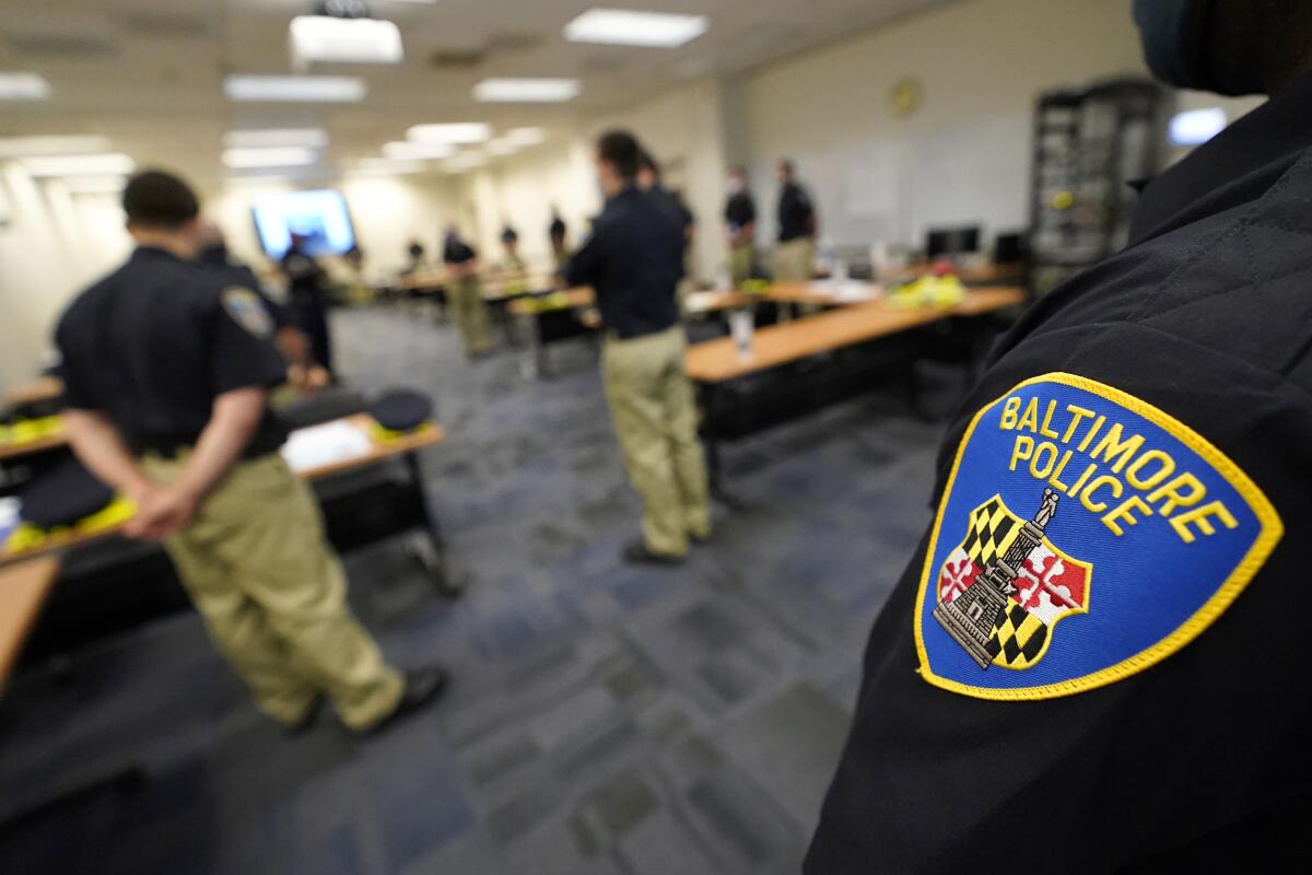 In this Sept. 9, 2020, photo Baltimore Police Academy cadets listen to an instructor during a class focusing on procedural justice in Baltimore. (AP Photo/Julio Cortez)