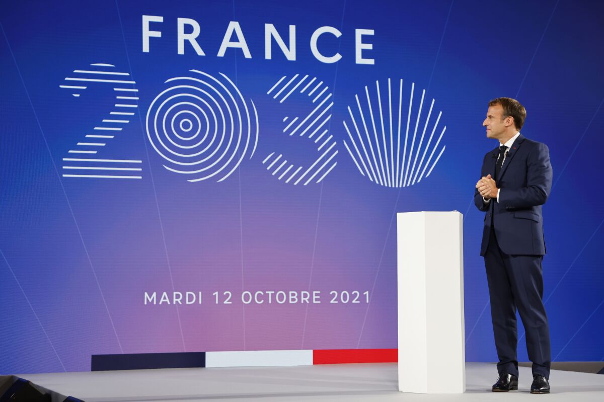 French President Emmanuel Macron speaks during the presentation of "France 2030" investment plan at the Elysee Palace in Paris, Tuesday Oct. 12, 2021.French President Emmanuel Macron details the priority sectors of the "France 2030" plan to "bring out the champions of tomorrow". (Ludovic Marin, Pool Photo via AP)