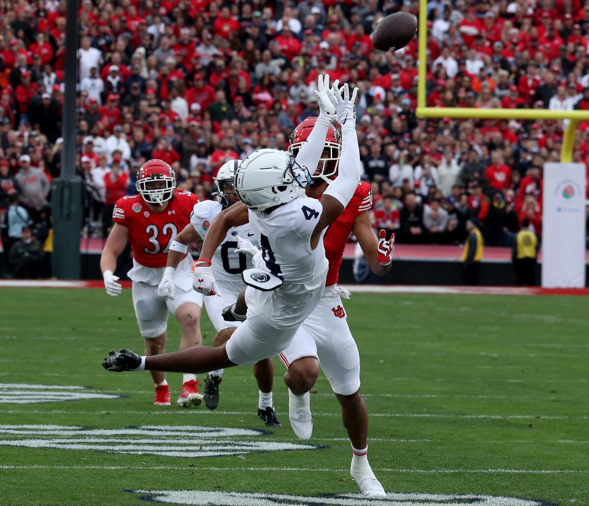 Penn State cornerback Kalen Ling intercepts a pass by Utah quarterback Cameron Rising in the first quarter.