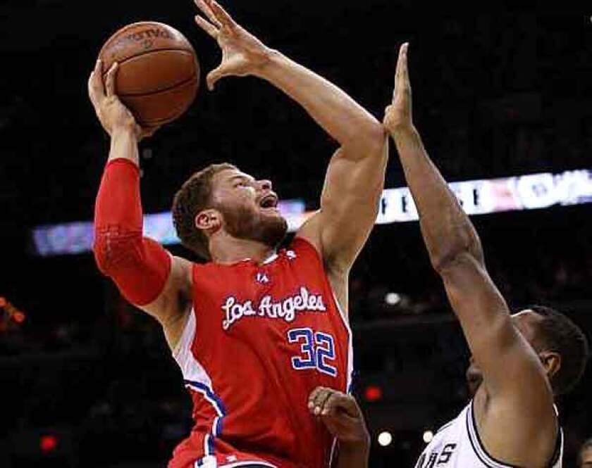 Clippers power forward Blake Griffin elevates for a shot over Spurs forward Boris Diaw in the first half of Game 2 on Thursday night in San Antonio.