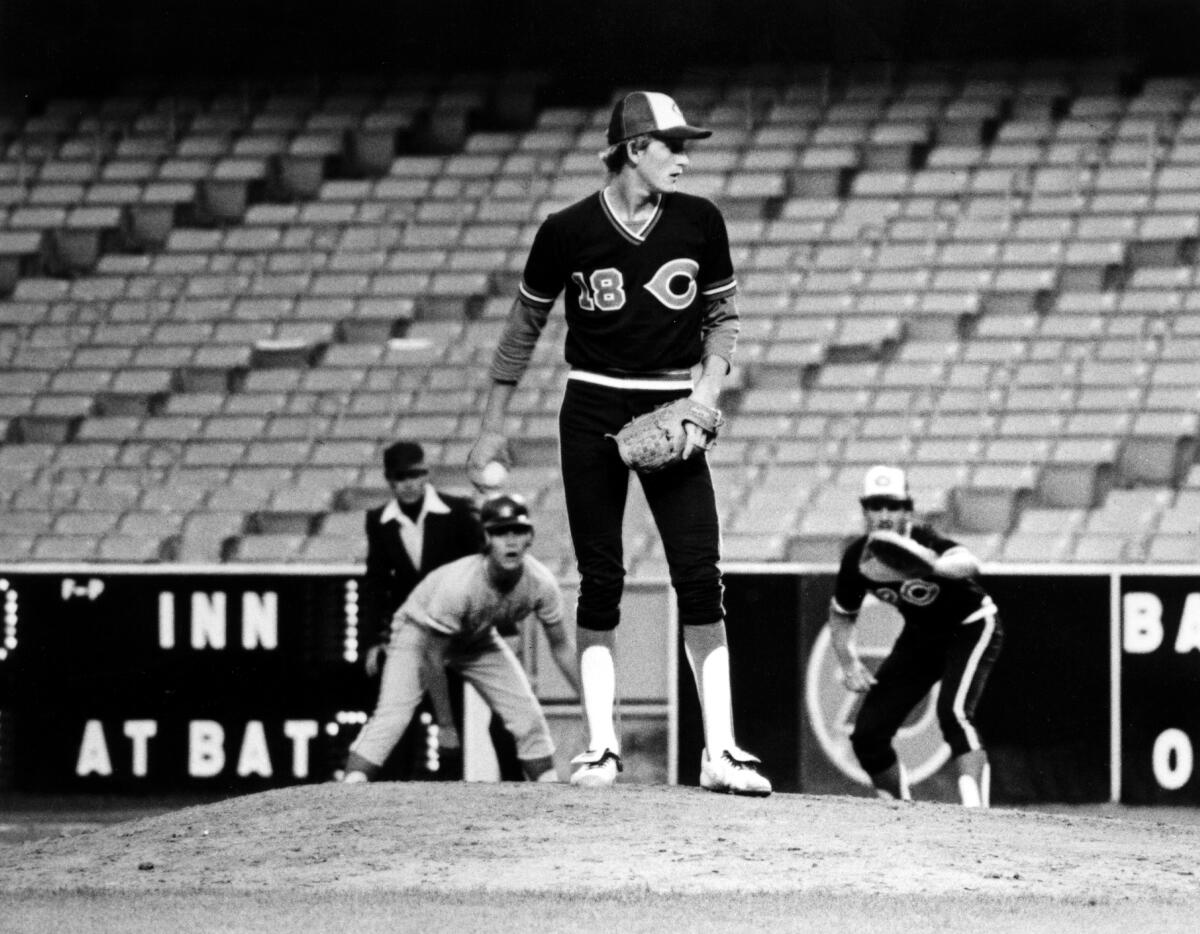 Bret Saberhagen checks for the sign with a runner on first base during the City championship game at Dodger Stadium in 1982.