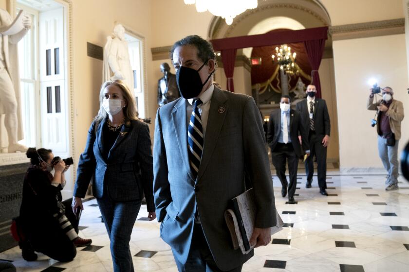 House Impeachment Managers Rep. Jamie Raskin (D-MD) (R) and Rep. Madeleine Dean (D-PA) wear protective masks 