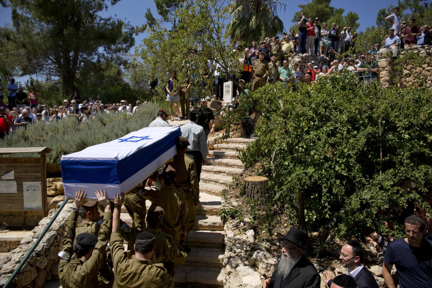 Israeli soldiers carry the coffin of Israel Defense Forces Sgt. Max Steinberg, an L.A. native, during his funeral Wednesday at the military cemetery in Jerusalem.