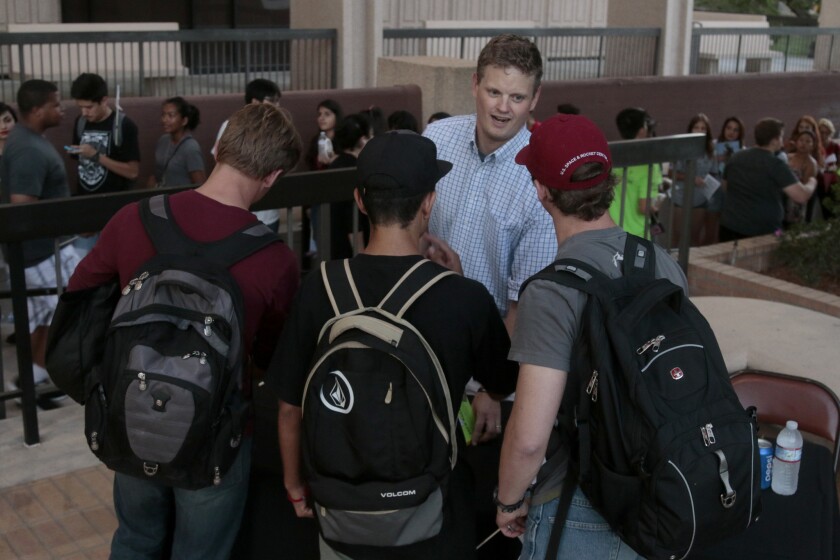 Author Drew Magary chats with a group of freshmen after CSU Northridge's freshman convocation at the school's Oviatt Library on Sept. 4.