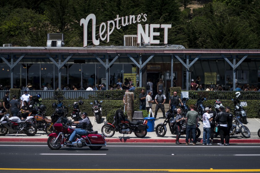 Bikers park in front of Neptune's Net in Malibu.