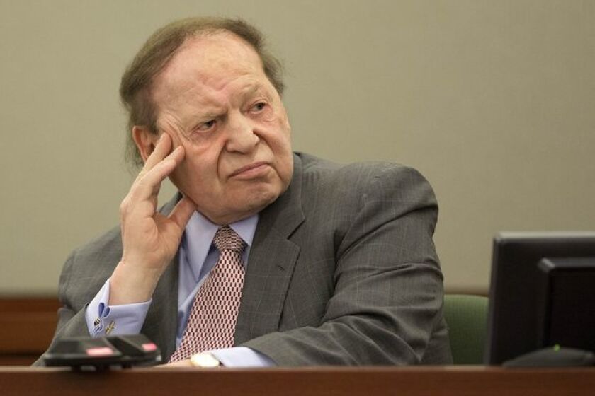 Las Vegas Sands Corp. CEO Sheldon Adelson testifies in a Las Vegas courtroom in April in a lawsuit filed by a former consultant. On Tuesday a jury awarded the consultant $70 million.