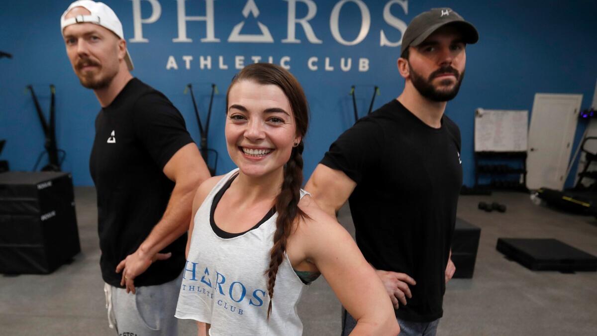 Pieter Vodden, left, with Emylee Covell and Jeff Scarborough are coaches and co-owners of the Pharos Athletic Club in Echo Park.