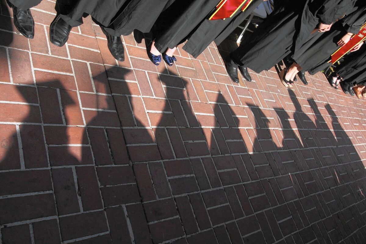 USC students line up for graduation in 2011.  This year's ceremony will be virtual. 