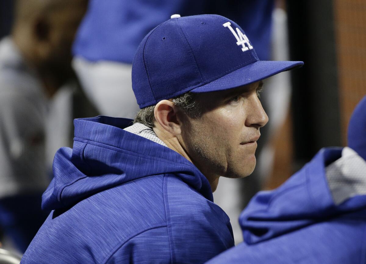 Dodgers' Chase Utley watches play from the dugout during the ninth inning against the New York Mets on Oct. 13, 2015.
