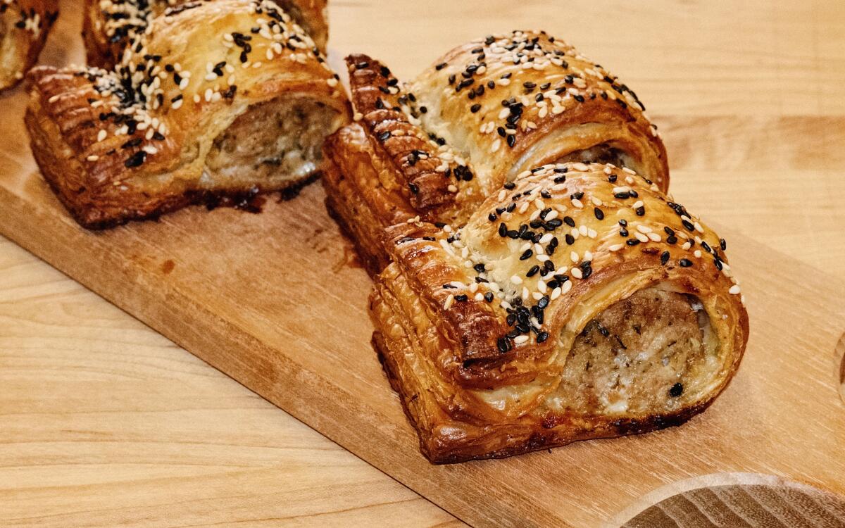 Sausage rolls, an Australian specialty, dotted with white and black sesame seeds