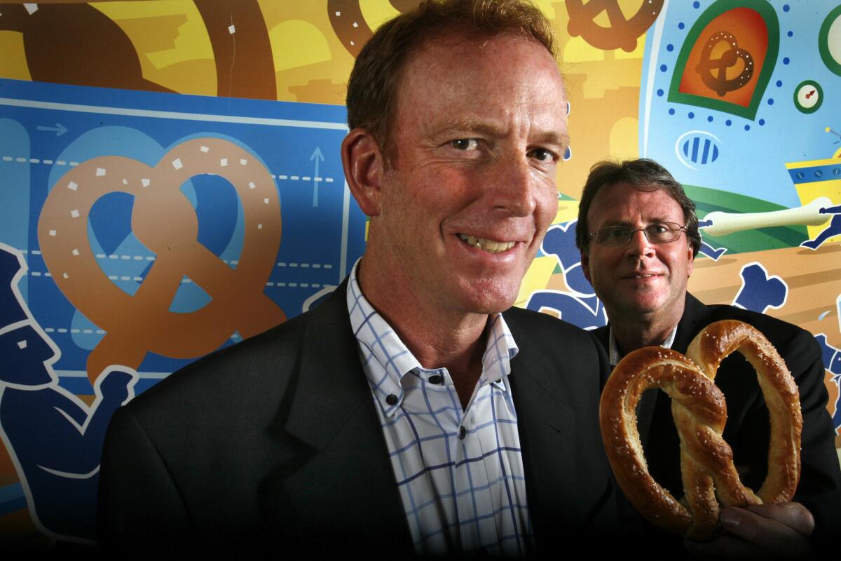Pasadena-based Wetzel's Pretzels has been sold to a Dallas private equity firm. Bill Phelps, above left, will remain on as CEO, while co-founder Rick Wetzel will retain a board seat.