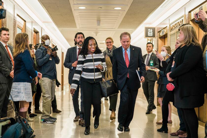 Supreme Court nominee Ketanji Brown Jackson, flanked by Former Alabama Senator Doug Jones