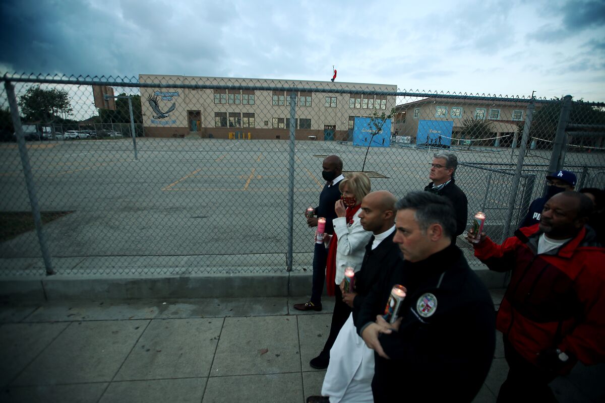 Elected officials join residents of Wilmington in a candlelight vigil