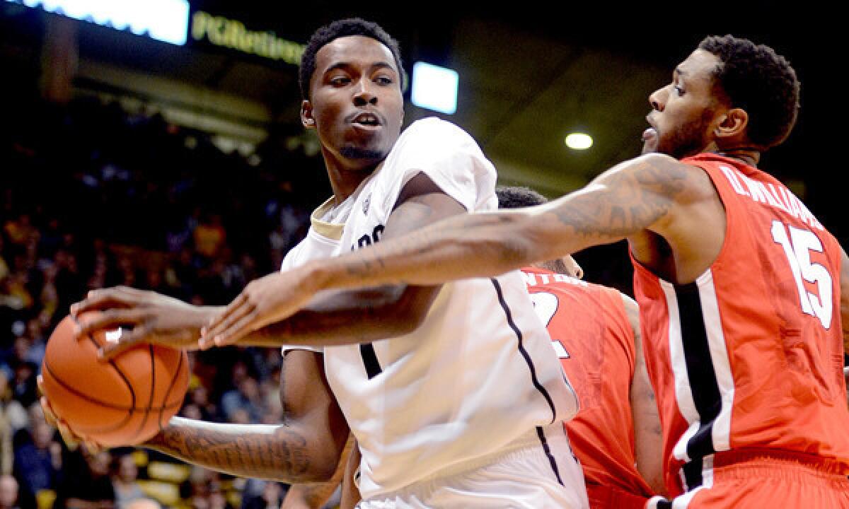 Colorado's Wesley Gordon, left, grabs an offensive rebound in front of Georgia's Donte Williams during an 84-70 win on Saturday. The Buffaloes are a favorite for the Pac-12 title.